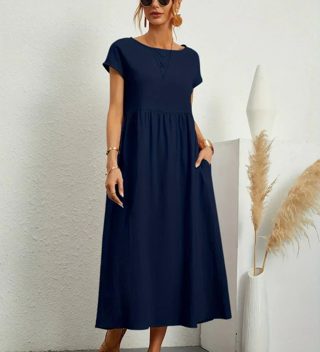 Gunta – Plūstoša midi kleita mūžīgai elegancei
