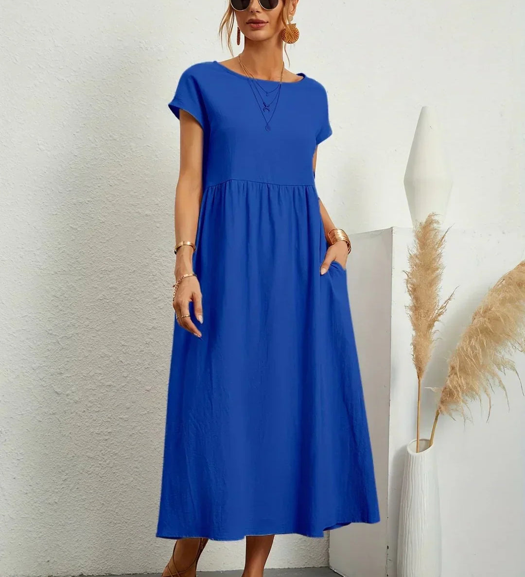 Gunta – Plūstoša midi kleita mūžīgai elegancei